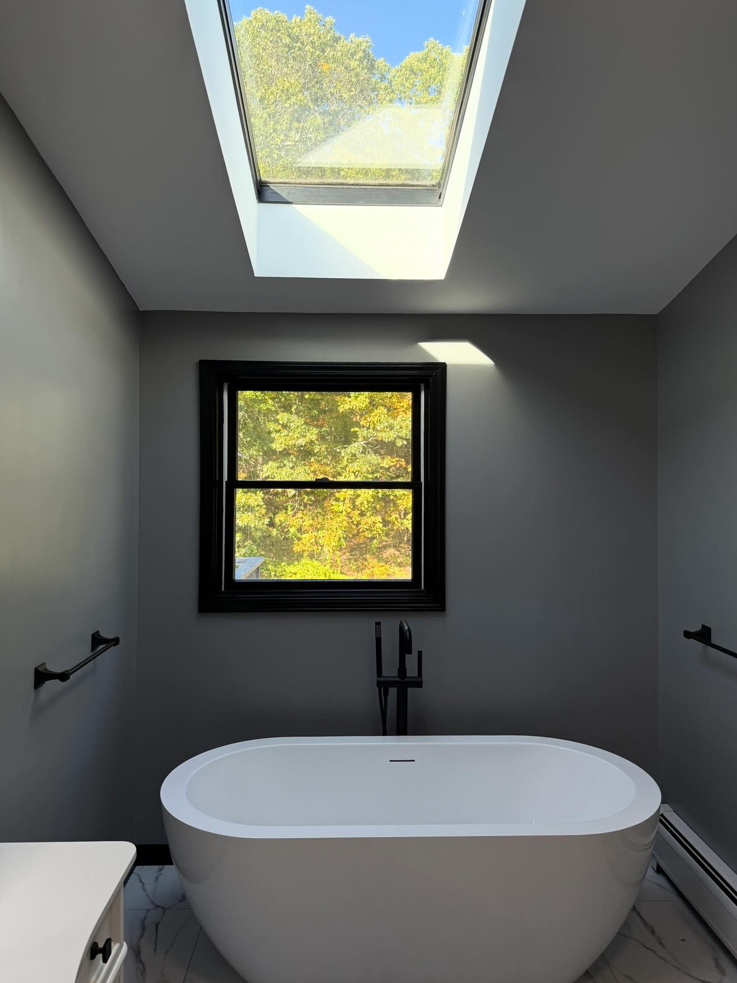 Rye master bathroom remodel — freestanding soaking tub, walk-in shower, and double vanity