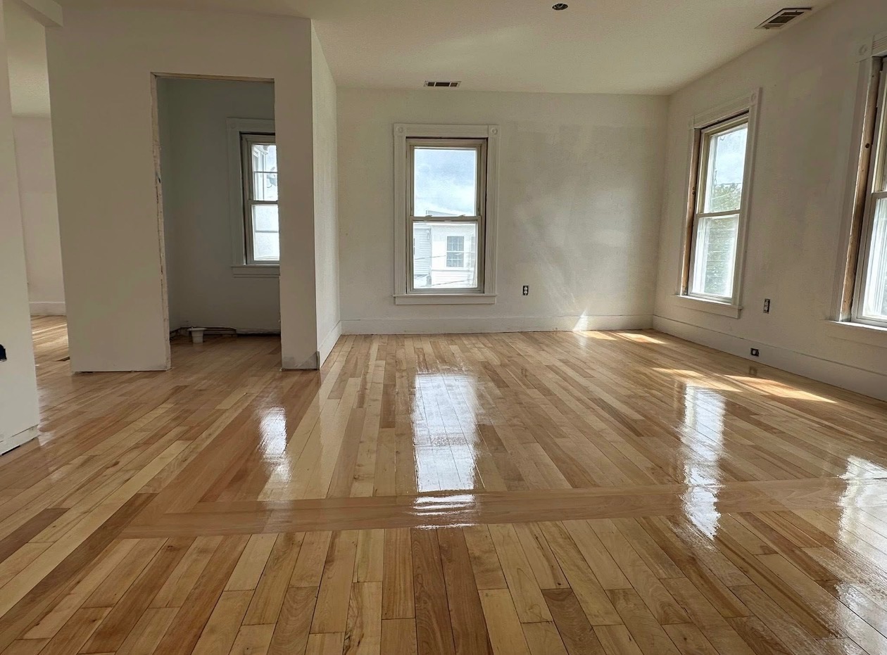Rye luxury vinyl plank installation — grey wood-look LVP in a bright open room