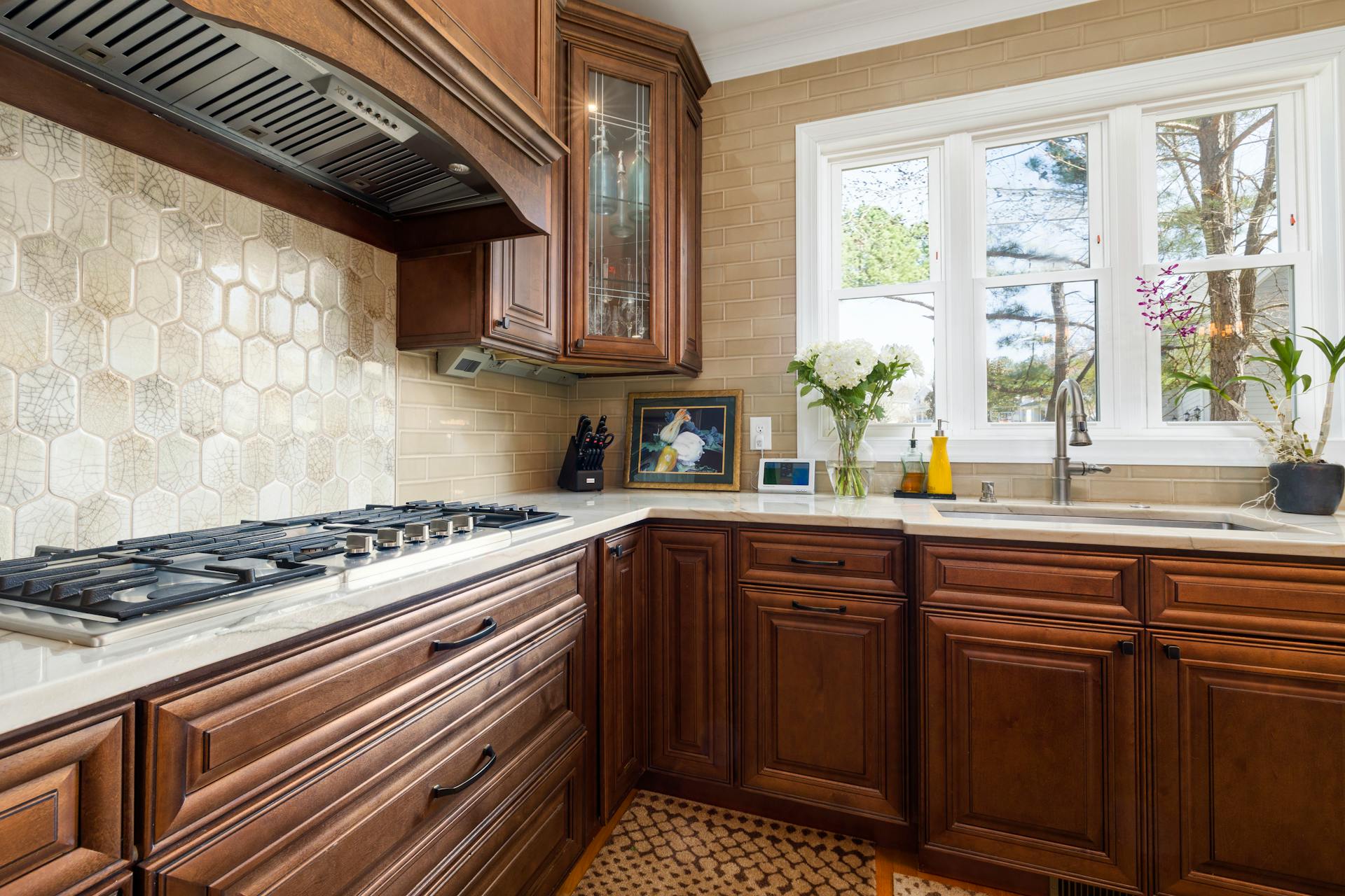 Stratham kitchen remodel — white shaker cabinets, quartz countertops, and subway tile backsplash
