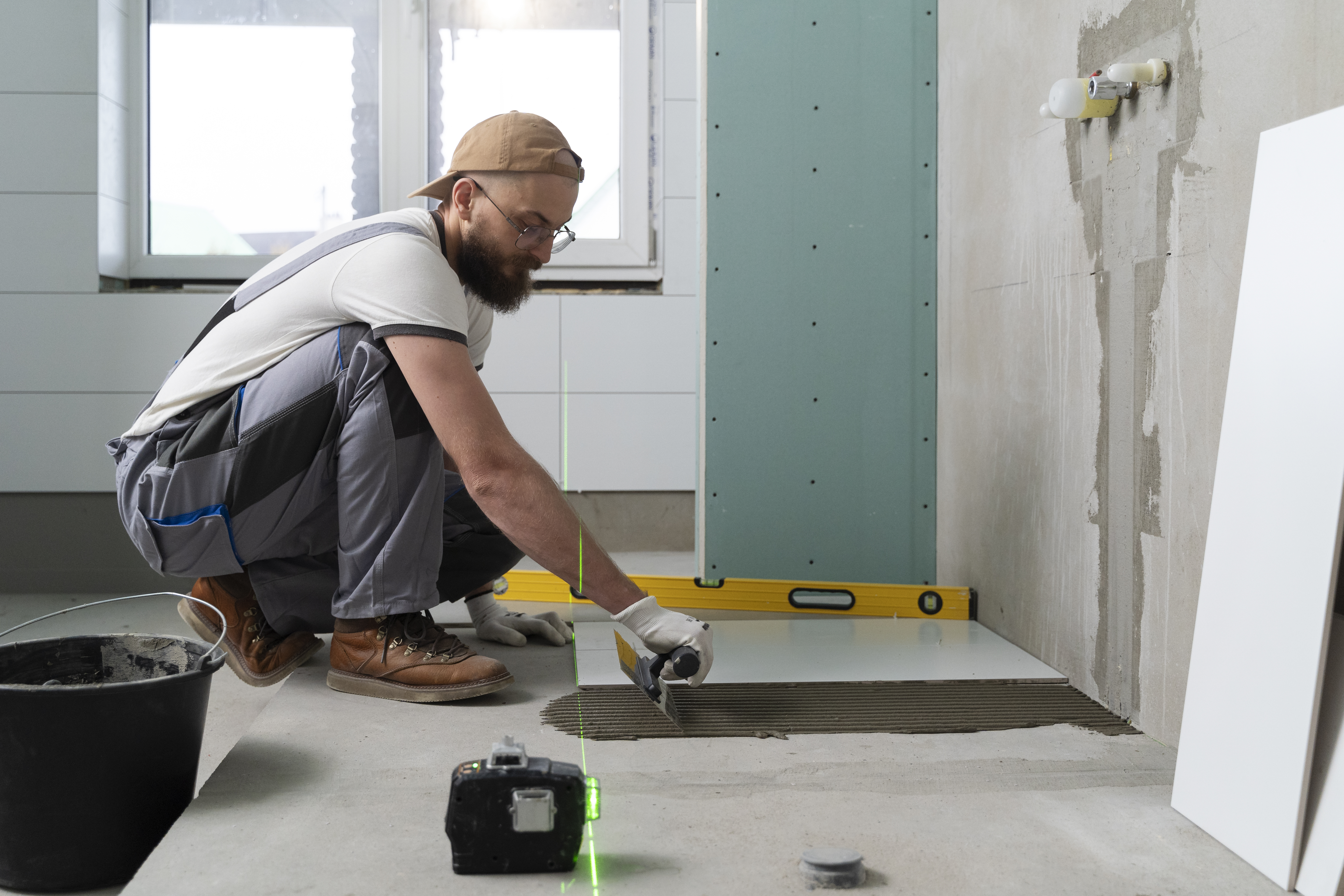 Contractor reviewing blueprints on a job site